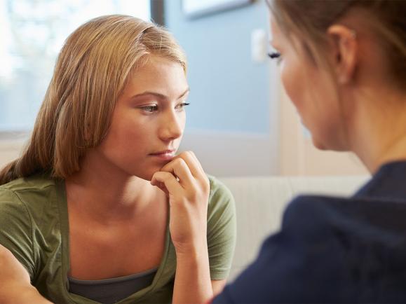 mom talking to teen daughter