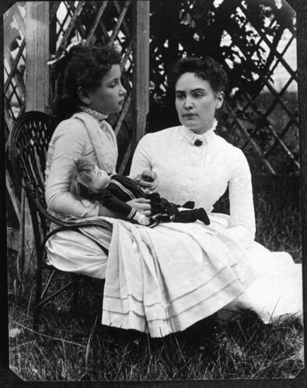 Eight-year-old Helen Keller with Anne Sullivan.