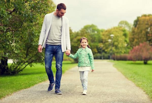 Father and daughter walking