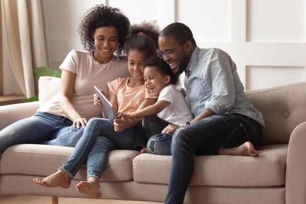 Family on couch with young girl