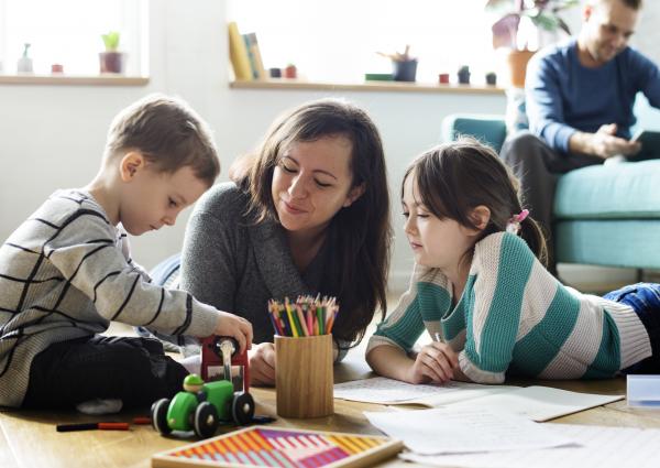 Small children color with mom