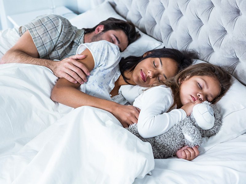 divorced parents kids sleeping in mattress